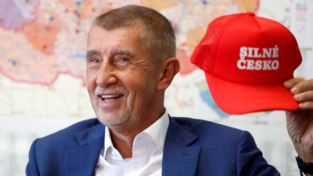 Babis holding a MAGA-like hat that says "Strong Czech Republic" - image by Reuters